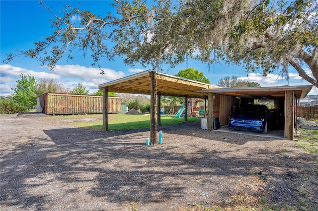 view of parking / parking lot featuring a playground