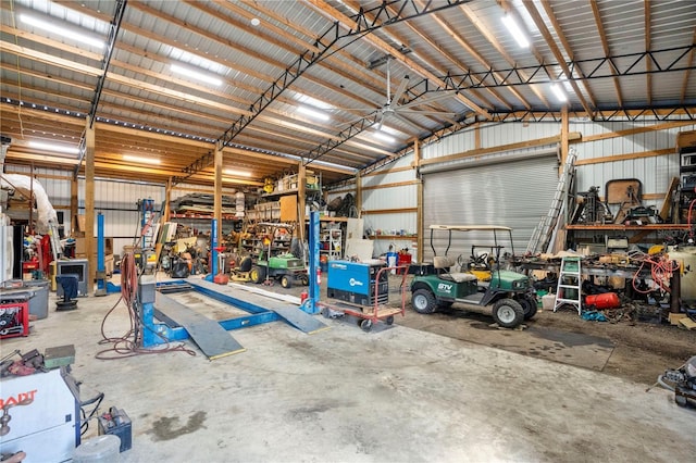 garage with a workshop area and metal wall