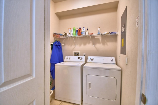 500 Monroe Cir, Davenport, FL 33896 - washroom with separate washer and dryer, laundry area, and light tile patterned flooring