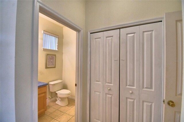 500 Monroe Cir, Davenport, FL 33896 - bathroom with a closet, tile patterned floors, toilet, and vanity