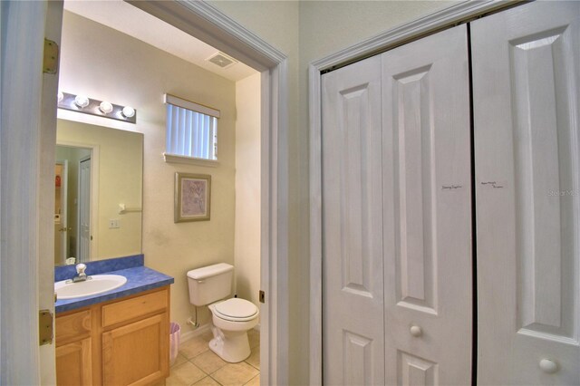 500 Monroe Cir, Davenport, FL 33896 - bathroom with vanity, toilet, tile patterned floors, visible vents, and a closet