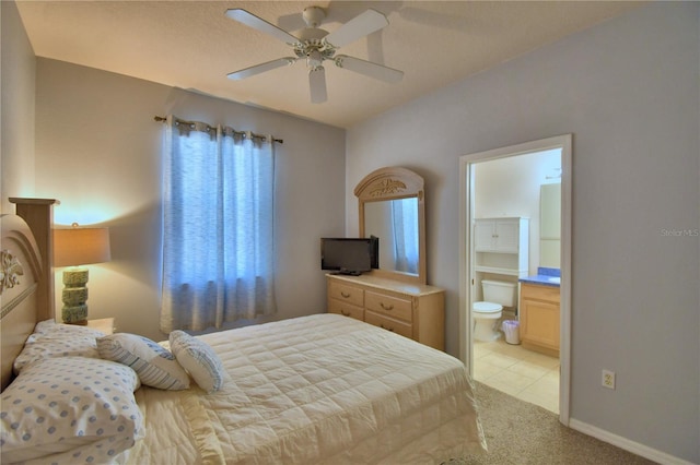 500 Monroe Cir, Davenport, FL 33896 - bedroom featuring baseboards, ceiling fan, connected bathroom, and light colored carpet