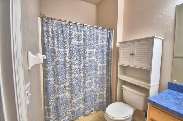 500 Monroe Cir, Davenport, FL 33896 - bathroom with toilet, a shower with shower curtain, tile patterned flooring, and vanity