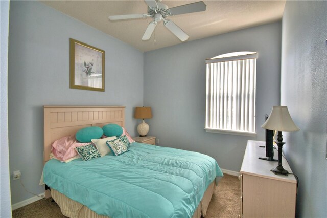 500 Monroe Cir, Davenport, FL 33896 - bedroom featuring baseboards, carpet, and a ceiling fan