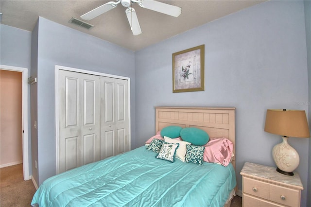 500 Monroe Cir, Davenport, FL 33896 - bedroom featuring ceiling fan, visible vents, baseboards, a closet, and carpet flooring