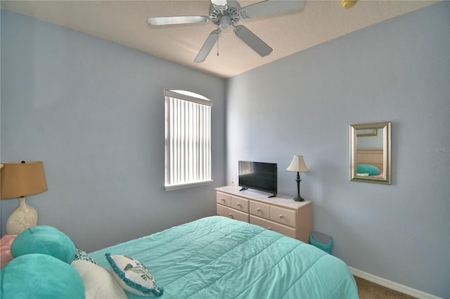 500 Monroe Cir, Davenport, FL 33896 - carpeted bedroom with baseboards and a ceiling fan