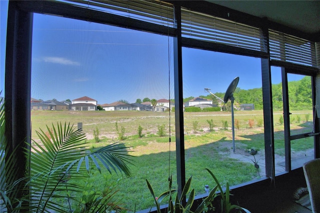 500 Monroe Cir, Davenport, FL 33896 - unfurnished sunroom featuring a residential view