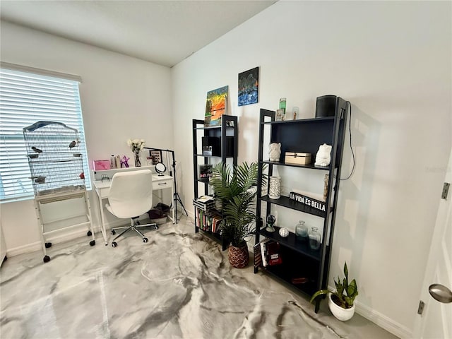 office area with concrete floors