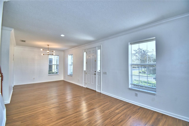 entryway with dark wood-type flooring, visible vents, plenty of natural light, and baseboards