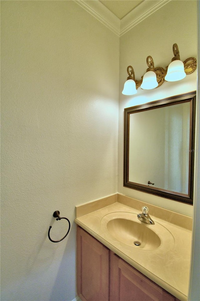 bathroom with vanity and crown molding