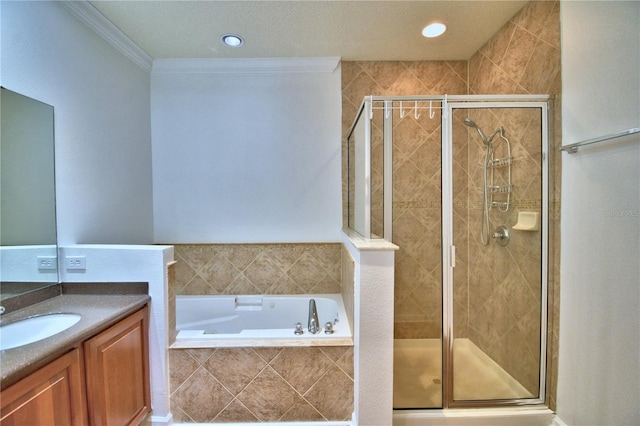 bathroom featuring crown molding, vanity, a shower stall, a bath, and recessed lighting