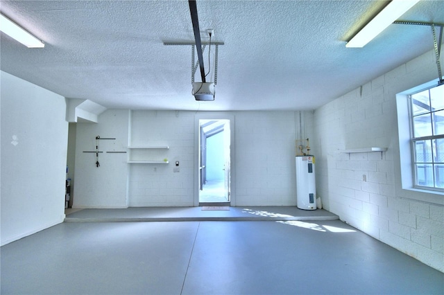 garage with concrete block wall, water heater, and a garage door opener