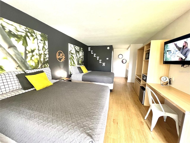 bedroom featuring light wood-style floors
