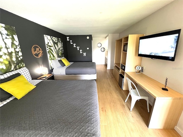 unfurnished bedroom featuring light wood-style floors