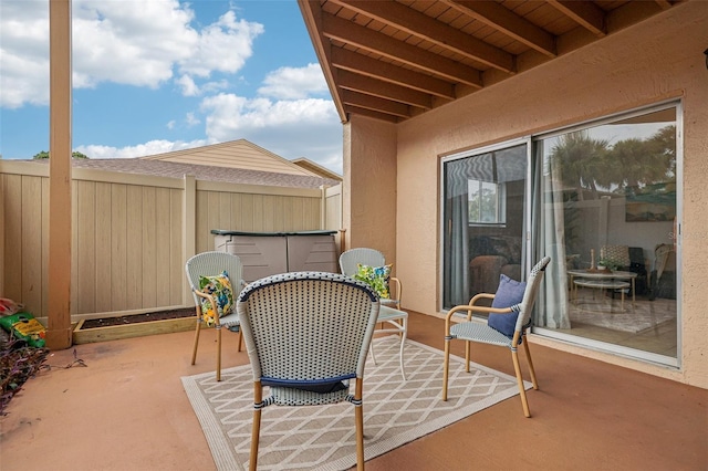 balcony featuring outdoor dining area and a patio