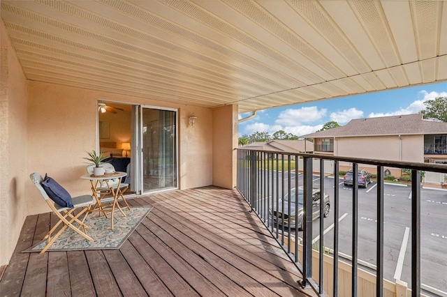 wooden deck with a residential view