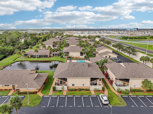 birds eye view of property with a residential view and a water view