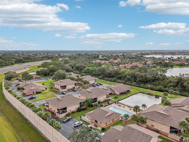 drone / aerial view with a water view