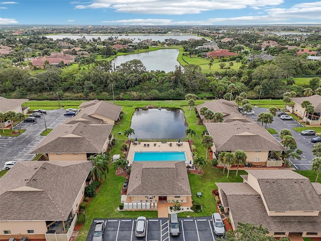 bird's eye view with a water view and a residential view