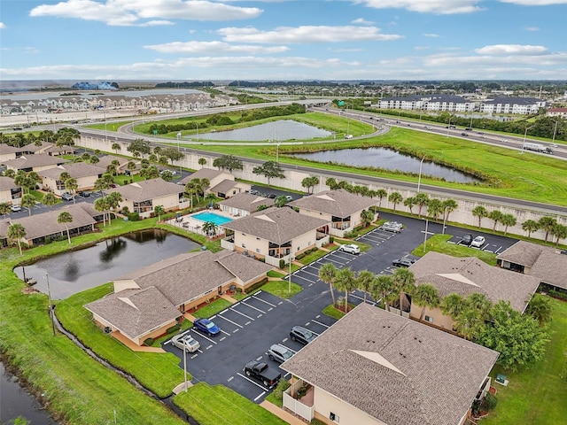 bird's eye view featuring a residential view and a water view