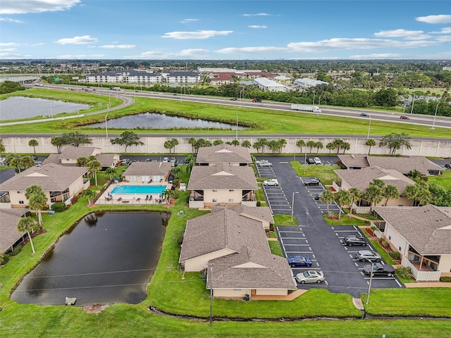 bird's eye view with a residential view and a water view