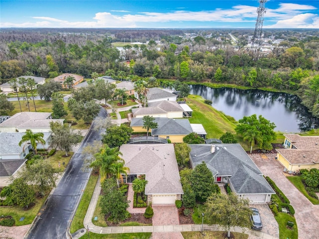 drone / aerial view featuring a water view and a residential view