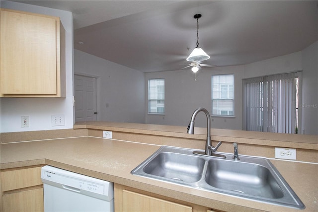 kitchen featuring a sink, light countertops, dishwasher, and light brown cabinetry