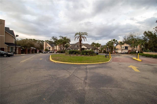 view of street featuring a residential view and curbs