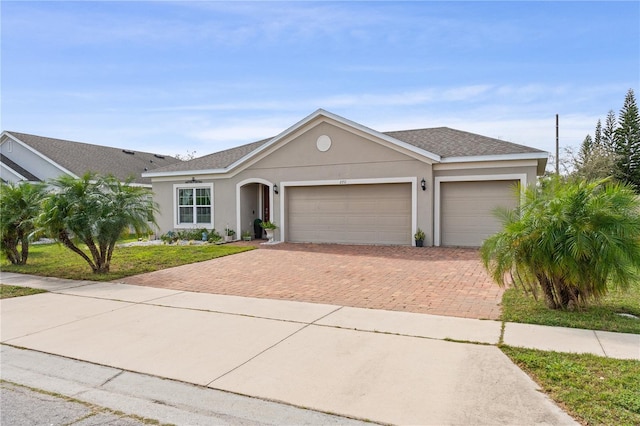 ranch-style home with a garage