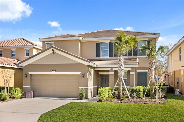 view of front of home featuring a garage and a front lawn