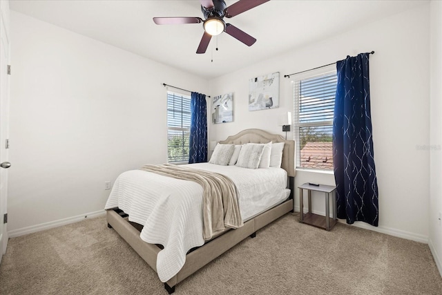 bedroom featuring ceiling fan and light carpet