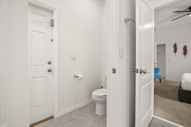 bathroom featuring tile patterned floors, ceiling fan, and toilet