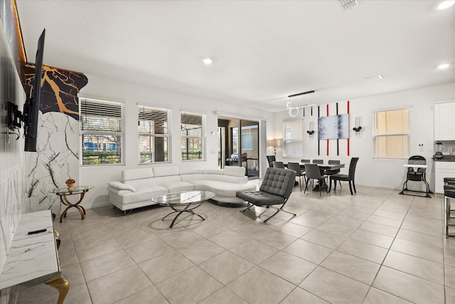 living room with light tile patterned flooring