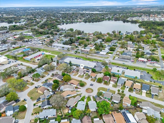 birds eye view of property with a residential view and a water view