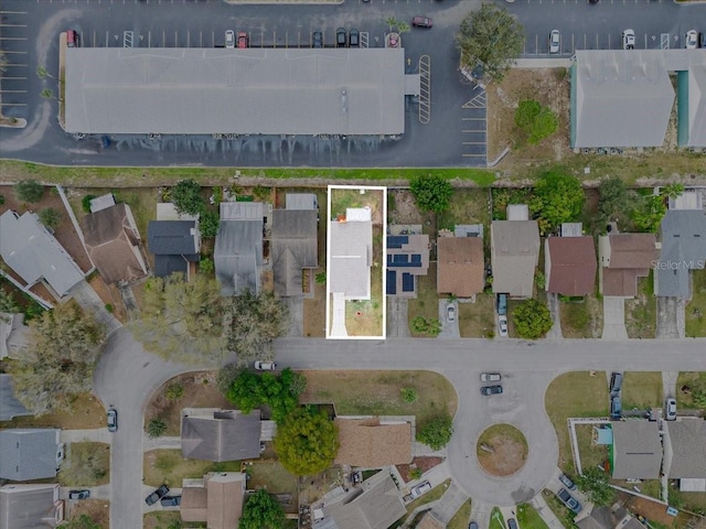 birds eye view of property with a residential view