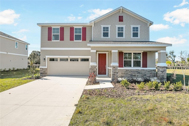 craftsman house with a front yard, stone siding, and driveway