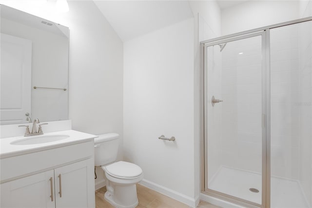 full bath with baseboards, a shower stall, toilet, and vanity