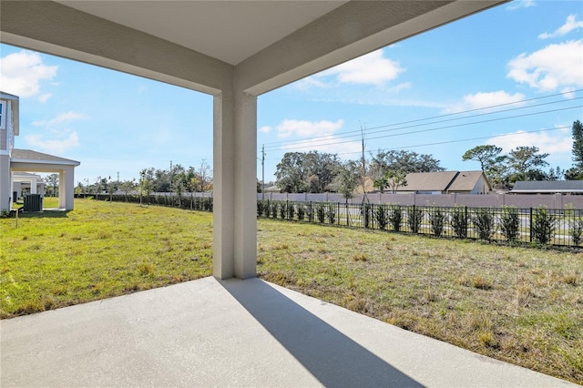 view of yard featuring central AC unit, a patio area, and fence