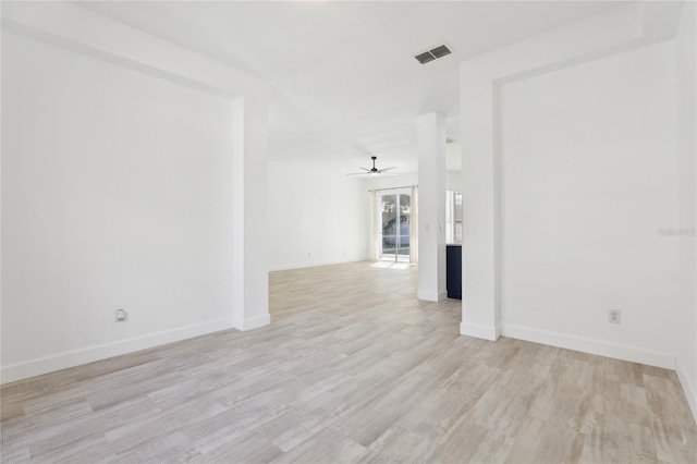 spare room featuring ceiling fan and light hardwood / wood-style floors
