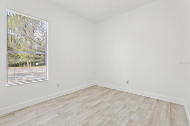 unfurnished room with light hardwood / wood-style flooring