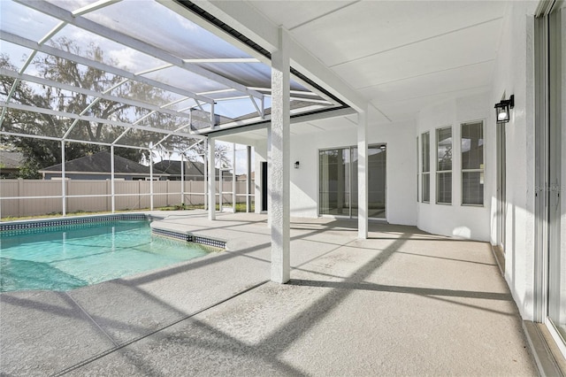 view of swimming pool with a lanai and a patio area