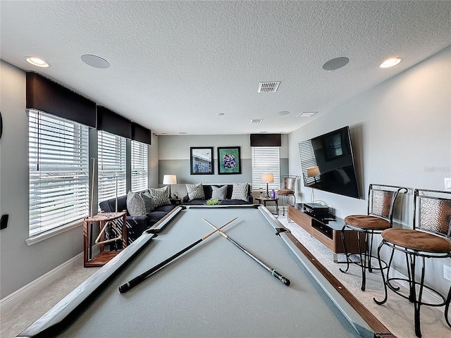 game room featuring pool table, visible vents, a textured ceiling, and baseboards