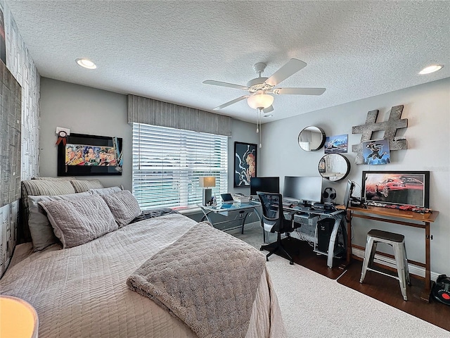 bedroom featuring baseboards, dark wood-style floors, ceiling fan, a textured ceiling, and recessed lighting