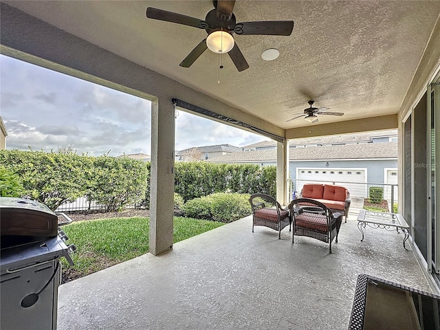 view of patio with ceiling fan, outdoor lounge area, and a fenced backyard