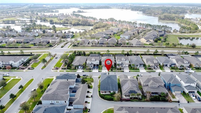 aerial view with a water view and a residential view