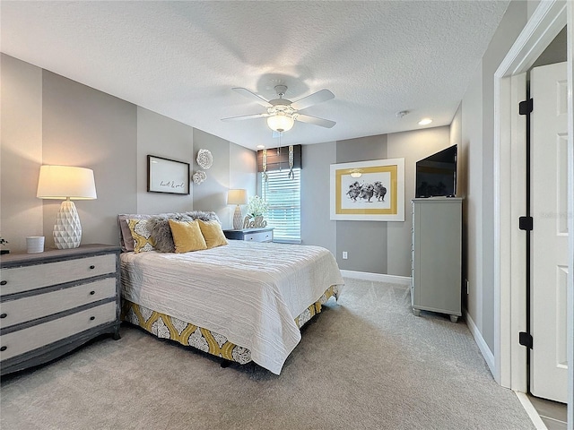 16150 Parkwyn St, Winter Garden, FL 34787 - bedroom with light colored carpet, baseboards, a ceiling fan, and a textured ceiling