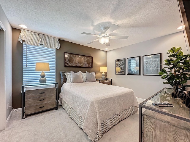 16150 Parkwyn St, Winter Garden, FL 34787 - bedroom featuring baseboards, a textured ceiling, a ceiling fan, and light colored carpet