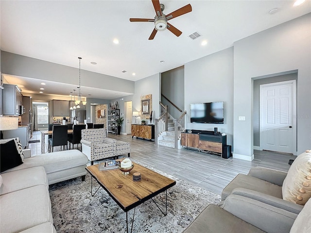 16150 Parkwyn St, Winter Garden, FL 34787 - living area featuring stairway, a ceiling fan, baseboards, visible vents, and recessed lighting