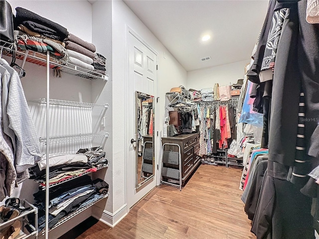 16150 Parkwyn St, Winter Garden, FL 34787 - walk in closet featuring wood finished floors and visible vents