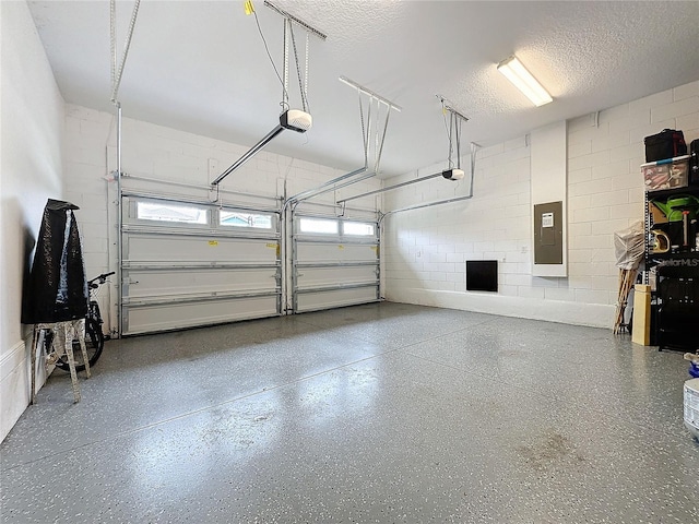 16150 Parkwyn St, Winter Garden, FL 34787 - garage with electric panel, a garage door opener, and concrete block wall